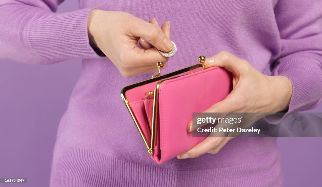 Woman with coin and purse