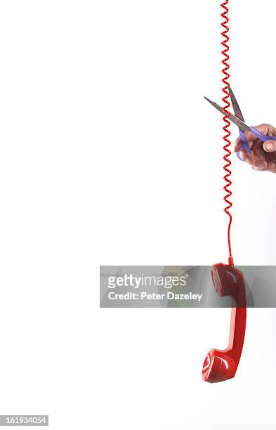 phone being cut off/sabotaged - man cutting wire stockfoto's en -beelden