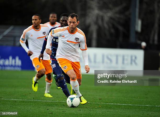 Brad Davis of the Houston Dynamo looks to pass during the first half of their game against the Chicago Fire at Blackbaud Stadium on February 16, 2013...