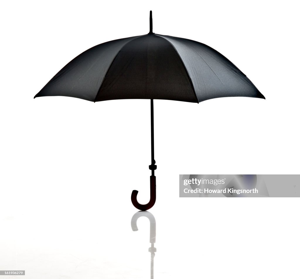Black umbrella on white background