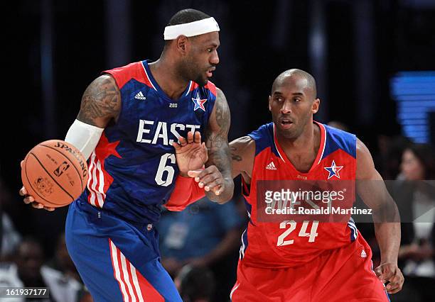 LeBron James of the Miami Heat and the Eastern Conference drives on Kobe Bryant of the Los Angeles Lakers and the Western Conference during the 2013...
