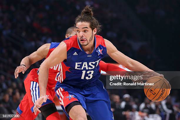 Joakim Noah of the Chicago Bulls and the Eastern Conference drives on Russell Westbrook of the Oklahoma City Thunder and the Western Conference...