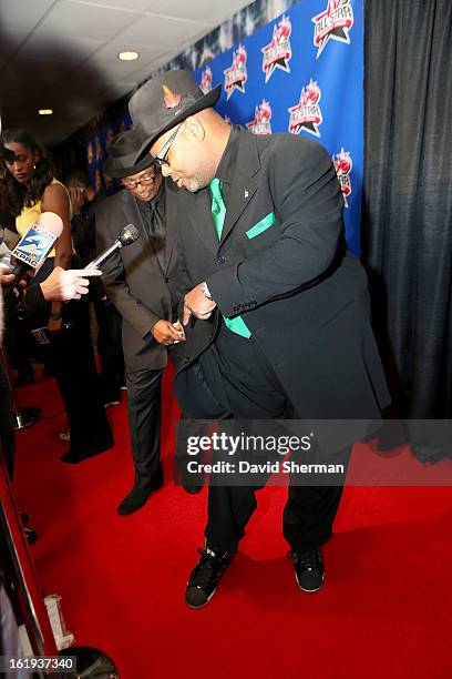 Music Producer Jimmy Jam Harris shows off his shoes on the All-Star Red Carpet prior to the 2013 NBA All-Star Game presented by Kia Motors on...