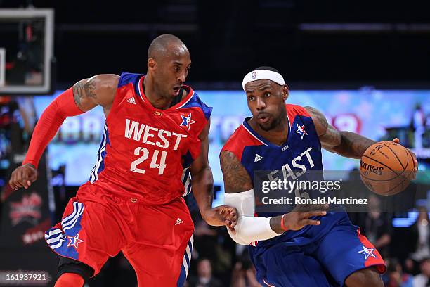 LeBron James of the Miami Heat and the Eastern Conference drives on Kobe Bryant of the Los Angeles Lakers and the Western Conference during the 2013...