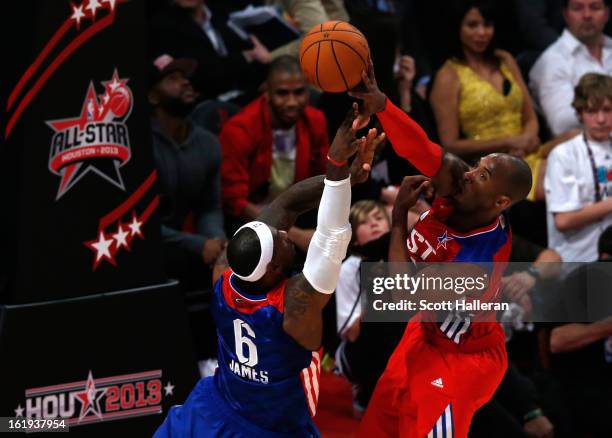 Kobe Bryant of the Los Angeles Lakers and the Western Conference blocks the shot of LeBron James of the Miami Heat and the Eastern Conference in the...