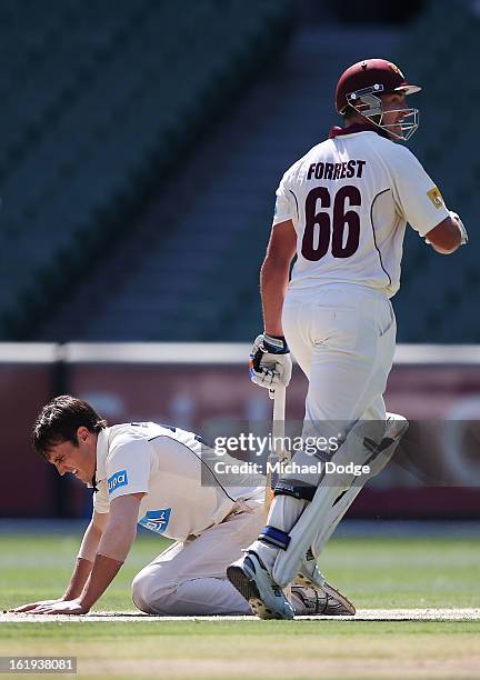 Bowler Will Sheridan of the Bushrangers reacts after being hit to the boundary by Peter Forrest of the Queensland Bulls during day one of the...