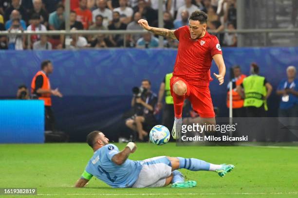 Lucas Ocampos of Sevilla is challenged by Kyle Walker of Manchester City during the UEFA Super Cup 2023 match between Manchester City FC and Sevilla...