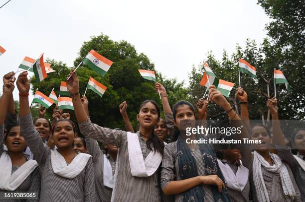 Students of Government Girls Senior Secondary school celebrating the successful landing of the Chandrayaan-3 lunar exploration mission on by the...