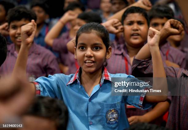 School students watching the live telecast of Chandrayaan-3 landing on the Moon at Sector 20 Brahmananda Public School on August 23, 2023 in Noida,...