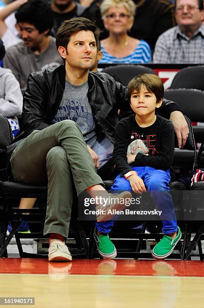 Actor Adam Scott and his son attend the Harlem Globetrotters "You Write The Rules" 2013 tour game at Staples Center on February 17, 2013 in Los...