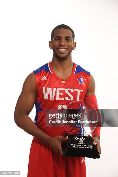 Chris Paul of the Western Conference All-Stars poses for a portrait with the 2013 Kia MVP Trophy after the 2013 NBA All-Star Game at Toyota Center on...