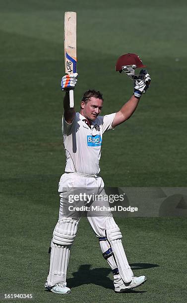 Peter Forrest of the the Queensland Bulls celebrates his century during day one of the Sheffield Shield match between the Victorian Bushrangers and...