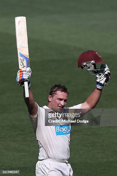 Peter Forrest of the the Queensland Bulls celebrates his century during day one of the Sheffield Shield match between the Victorian Bushrangers and...