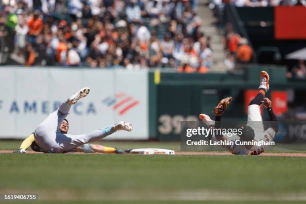 Jose Siri of the Tampa Bay Rays is tagged out by Thairo Estrada of the San Francisco Giants at second base after hitting a single in the fourth...