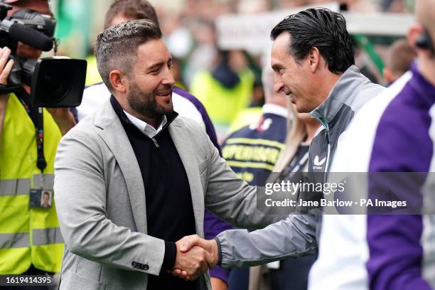 Hibernian manager Lee Johnson shakes hands with Aston Villa manager Unai Emery before the first leg of the UEFA Europa Conference League play off...