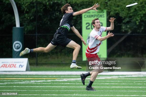 Jonny Malks of the DC Breeze catches a pass under defensive pressure from Matt Stevens of the New York Empire during the AUDL East Division...