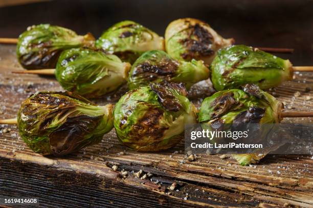 flame grilled brussels sprouts kebabs - brussels sprout stock pictures, royalty-free photos & images