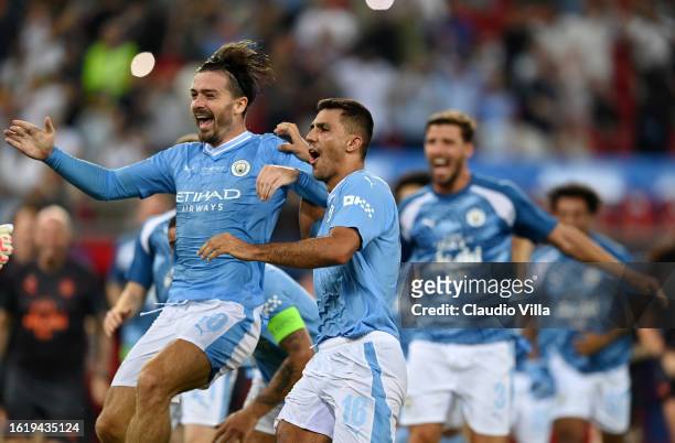 Jack Grealish and Rodri of Manchester City celebrate following the team's victory in the penalty shoot out during the UEFA Super Cup 2023 match...