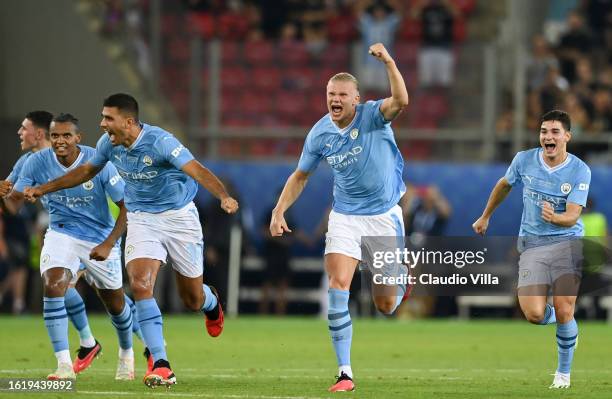 Erling Haaland of Manchester City celebrates with teammates following the team's victory in the penalty shoot out in the UEFA Super Cup 2023 match...