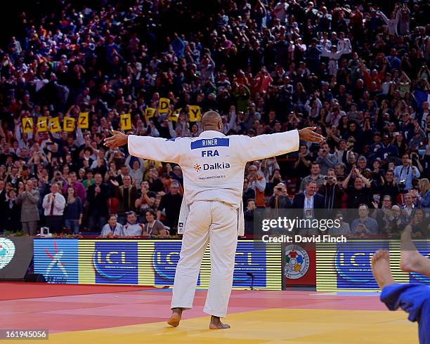 Teddy Riner of France acknowledges the enthusiasm of the audience after winning his sixth Paris title with the best throw of the tournament during...