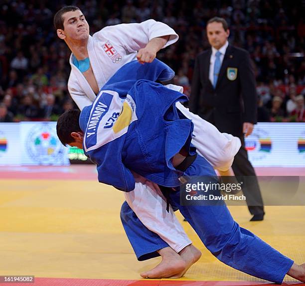 Yakhyo Imamov of Uzbekistan catches Avtandil Tchrikishvili of Georgia with an inner leg hook to throw him for ippon and win the u81kgs gold medal at...
