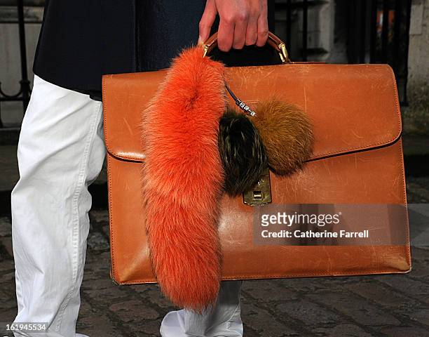 Victor Philpott, blogger, holding a vintage brief case accessorised with Hockley fur at London Fashion Week Fall/Winter 2013/14 on February 16, 2013...