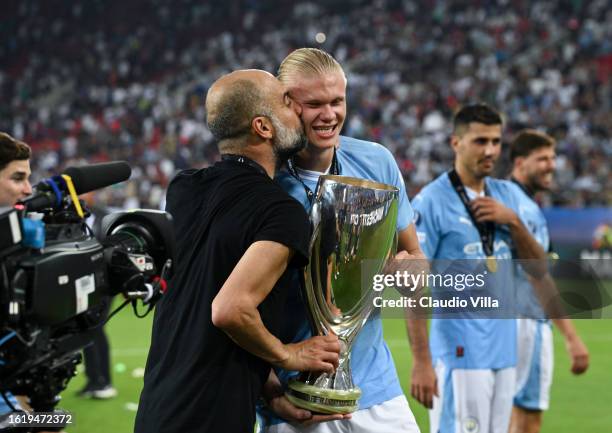 Pep Guardiola, Manager of Manchester City, kisses Erling Haaland after the team's victory in the UEFA Super Cup 2023 match between Manchester City FC...