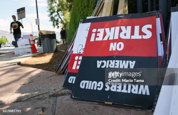 Strike signs are collected after a picket outside Disney Studios on August 16, 2023 in Burbank, California. The Writers Guild of America reportedly...