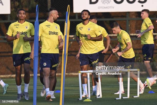 Joshua King , Alexander Djiku , and Serdar Dursun of Fenerbahce take part in a training session ahead of UEFA Europa Conference League play-off match...