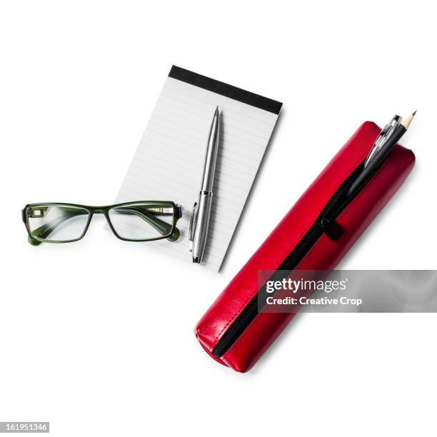 leather pencil case and pencils with pad & glasses - etui stockfoto's en -beelden