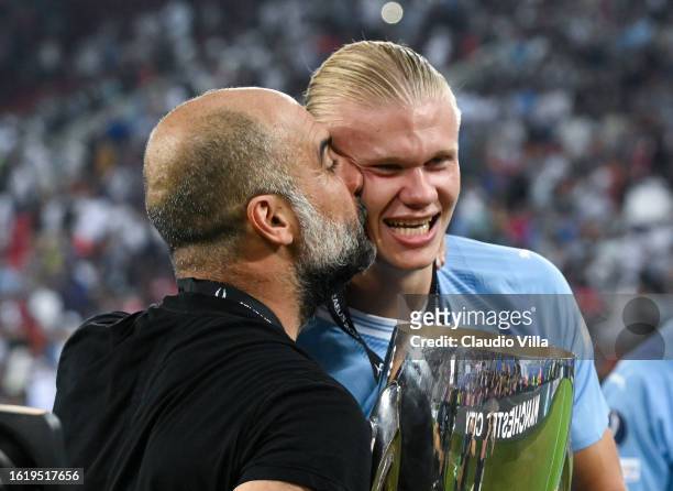 Pep Guardiola, Manager of Manchester City, kisses Erling Haaland after the team's victory in the UEFA Super Cup 2023 match between Manchester City FC...