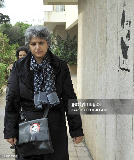 The widow of murdered opposition figure Chokri Belaid, Besma Khalfaoui, arrives at the site of the vandalised and broken statue erected in his...