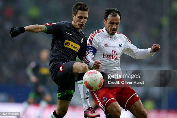 Heiko Westermann of Hamburg and Patrick Herrmann of Gladbach battle for the ball during the Bundesliga match between Hamburger SV and Borussia...