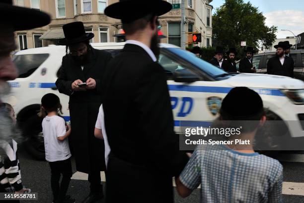 Thousands of Hasidic men converge for the funeral of Rachmastrivka Rebbe in Borough Park Brooklyn on August 16, 2023 in New York City. Rachmastrivka...