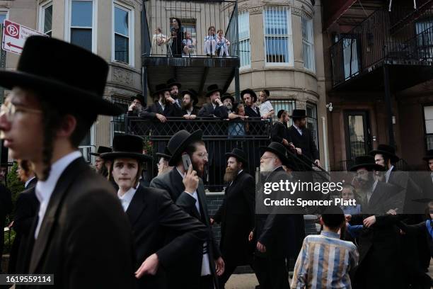 Thousands of Hasidic men converge for the funeral of Rachmastrivka Rebbe in Borough Park Brooklyn on August 16, 2023 in New York City. Rachmastrivka...