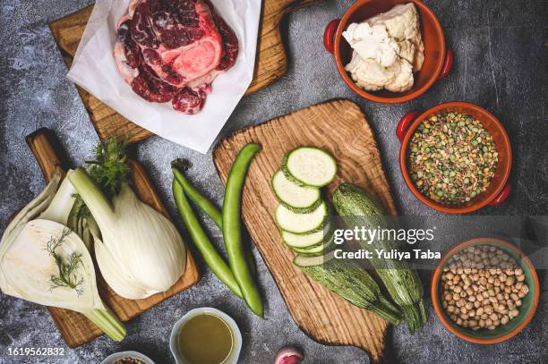 various ingredients raw beef and vegetables on a table. - zinc stock pictures, royalty-free photos & images