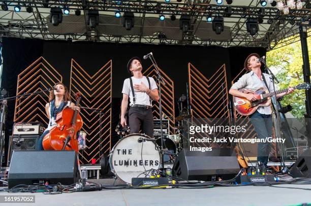 Neyla Pekarek on cello, Jeremiah Fraites on drums and Wesley Schultz on guitar and vocals of the Folk-Rock band The Lumineers from Denver, Colorado...