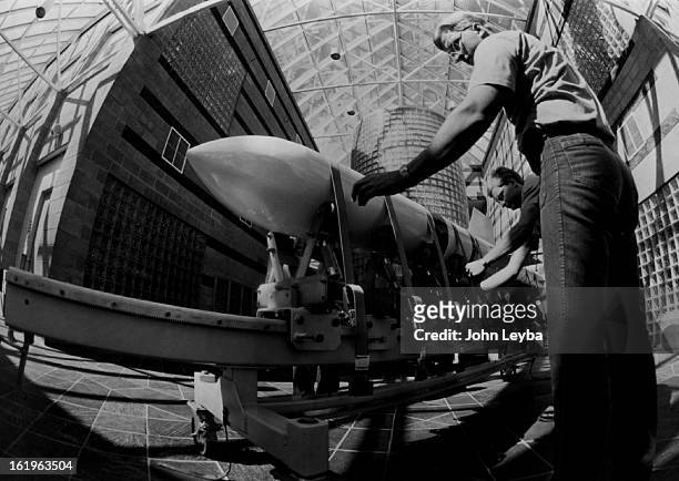 Missiles - Harpoon - United States; Steve Sherman checks the straps on the Mock Harpoon Missile. The Navy is building missile stands for Harpoon...