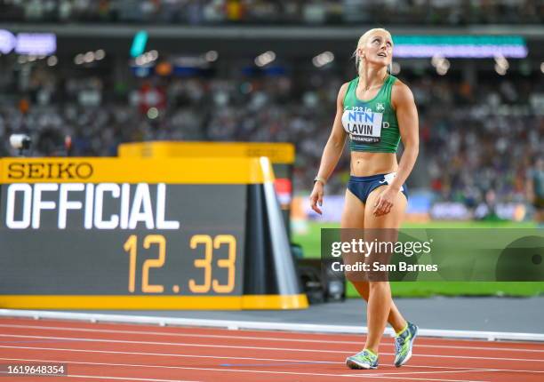 Budapest , Hungary - 23 August 2023; Sarah Lavin of Ireland reacts after she beats her national record in the women's 100m hurdles heats during day...