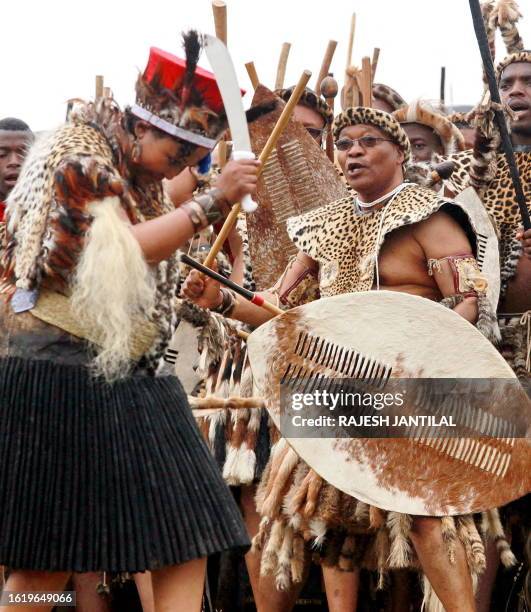 South African President Jacob Zuma , wearing leopard skins, sings and dances with his newly wed Thobeka Madiba at their wedding ceremony on January 4...