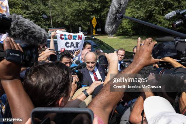 Rudy Giuliani talks to the media outside the Fulton County Jail after being booked on August 23, 2023 in Atlanta, Georgia. Giuliani is one of 19,...
