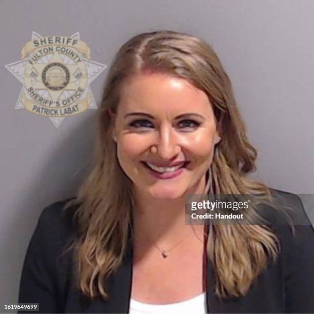 In this handout provided by the Fulton County Sheriff's Office, former Trump lawyer Jenna Ellis poses for her booking photo on August 23, 2023 in...