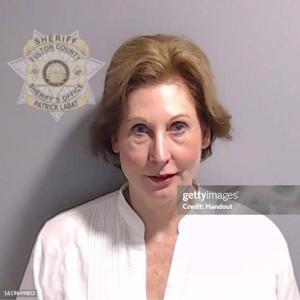 In this handout provided by the Fulton County Sheriff's Office, attorney Sidney Powell poses for her booking photo on August 23, 2023 in Atlanta,...