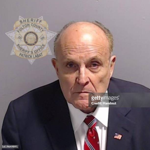 In this handout provided by the Fulton County Sheriff's Office, Rudy Giuliani, former personal lawyer for former President Donald Trump poses for his...