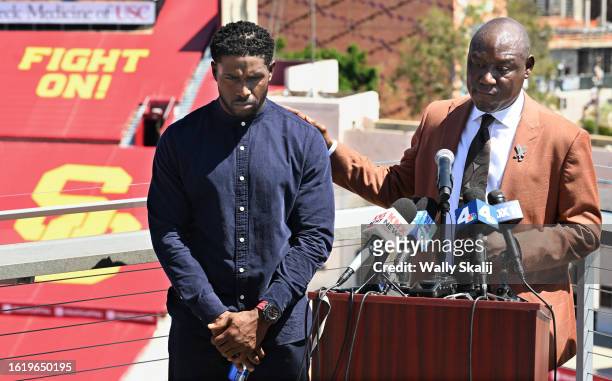Los Angeles, California August 23, 2023-Former USC running back Reggie Bush speaks with his lawyers Ben Crump to the media ay the Coliseum Wednesday...
