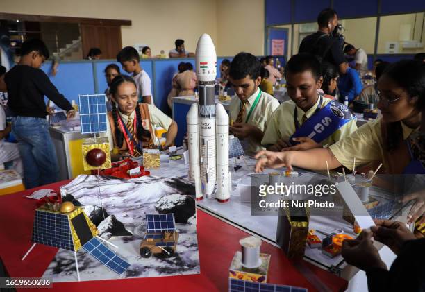 School children work on paper replicas of Chandrayaan-3, the Vikram Lander and the Pragyan rover during a workshop organized by the Nehru Science...