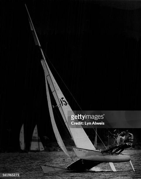 Dillon Dam & Reservoir; Mary Ford and Dan Zabel, who won their class in the regatta, are shown here hanging from trapezes to stabilize boat; *****;