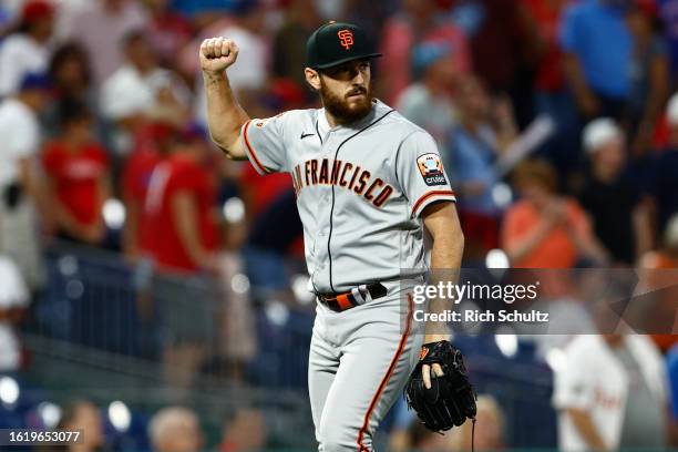 Relief pitcher Ryan Walker of the San Francisco Giants reacts after the final out in the 10th inning of a game against the Philadelphia Phillies at...