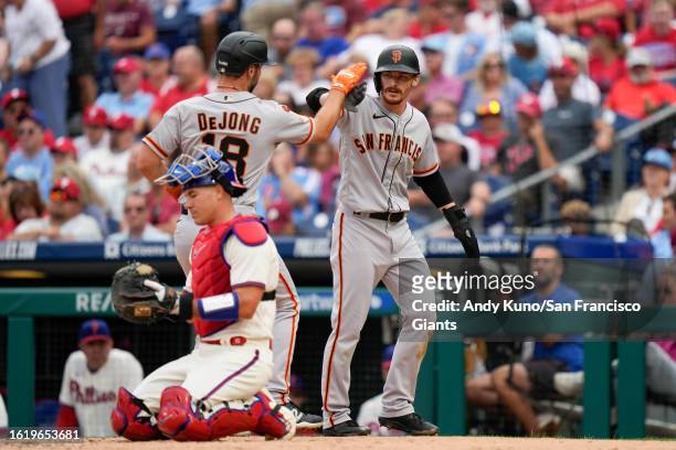 Wade Meckler and Paul DeJong of the San Francisco Giants celebrate in a game against the Philadelphia Phillies at Citizen Bank Park on August 23,...