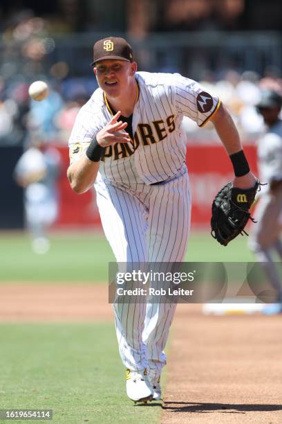 Garrett Cooper of the San Diego Padres throws to first in the second inning during the game between the Miami Marlins and the San Diego Padres at...